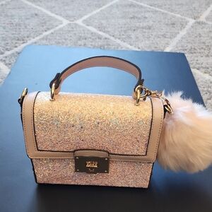 Aldo Glittering Pink Mini Bag with Plush Charm